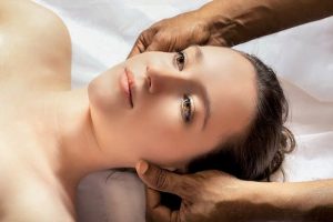 female getting massage in a massage centre